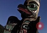 Image of totem poles Alaska USA, 1960, second 19 stock footage video 65675038983