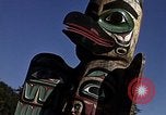 Image of totem poles Alaska USA, 1960, second 21 stock footage video 65675038983