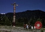 Image of totem poles Alaska USA, 1960, second 23 stock footage video 65675038983