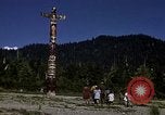Image of totem poles Alaska USA, 1960, second 24 stock footage video 65675038983