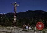Image of totem poles Alaska USA, 1960, second 25 stock footage video 65675038983