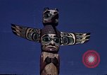 Image of totem poles Alaska USA, 1960, second 28 stock footage video 65675038983