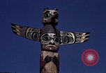Image of totem poles Alaska USA, 1960, second 30 stock footage video 65675038983