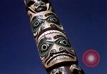 Image of totem poles Alaska USA, 1960, second 39 stock footage video 65675038983