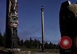 Image of totem poles Alaska USA, 1960, second 55 stock footage video 65675038983