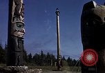 Image of totem poles Alaska USA, 1960, second 58 stock footage video 65675038983