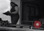Image of Hermann Goring with pet lion cub at his hunting lodge Germany, 1935, second 20 stock footage video 65675039012