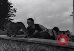 Image of Hermann Goring with pet lion cub at his hunting lodge Germany, 1935, second 32 stock footage video 65675039012