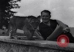 Image of Hermann Goring with pet lion cub at his hunting lodge Germany, 1935, second 38 stock footage video 65675039012