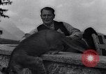 Image of Hermann Goring with pet lion cub at his hunting lodge Germany, 1935, second 43 stock footage video 65675039012