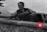 Image of Hermann Goring with pet lion cub at his hunting lodge Germany, 1935, second 45 stock footage video 65675039012
