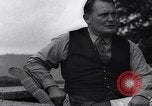Image of Hermann Goring with pet lion cub at his hunting lodge Germany, 1935, second 50 stock footage video 65675039012