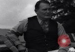 Image of Hermann Goring with pet lion cub at his hunting lodge Germany, 1935, second 52 stock footage video 65675039012