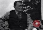 Image of Hermann Goring with pet lion cub at his hunting lodge Germany, 1935, second 53 stock footage video 65675039012