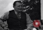 Image of Hermann Goring with pet lion cub at his hunting lodge Germany, 1935, second 54 stock footage video 65675039012