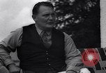 Image of Hermann Goring with pet lion cub at his hunting lodge Germany, 1935, second 55 stock footage video 65675039012