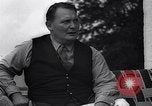 Image of Hermann Goring with pet lion cub at his hunting lodge Germany, 1935, second 56 stock footage video 65675039012