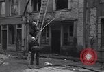 Standbild Französische Feuerwehrleute Zweiten Weltkrieg Carentan Normandie Frankreich, 1944, aus Sekunde 45 historischem Filmmaterial Videoclip 65675039037