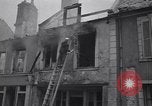 Standbild Französische Feuerwehrleute Zweiten Weltkrieg Carentan Normandie Frankreich, 1944, aus Sekunde 51 historischem Filmmaterial Videoclip 65675039037