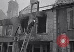 Standbild Französische Feuerwehrleute Zweiten Weltkrieg Carentan Normandie Frankreich, 1944, aus Sekunde 53 historischem Filmmaterial Videoclip 65675039037