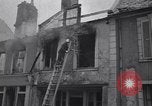 Standbild Französische Feuerwehrleute Zweiten Weltkrieg Carentan Normandie Frankreich, 1944, aus Sekunde 54 historischem Filmmaterial Videoclip 65675039037