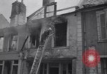 Standbild Französische Feuerwehrleute Zweiten Weltkrieg Carentan Normandie Frankreich, 1944, aus Sekunde 57 historischem Filmmaterial Videoclip 65675039037