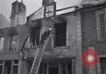 Standbild Französische Feuerwehrleute Zweiten Weltkrieg Carentan Normandie Frankreich, 1944, aus Sekunde 58 historischem Filmmaterial Videoclip 65675039037