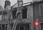 Standbild Französische Feuerwehrleute Zweiten Weltkrieg Carentan Normandie Frankreich, 1944, aus Sekunde 59 historischem Filmmaterial Videoclip 65675039037
