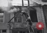 Standbild Französische Feuerwehrleute Zweiten Weltkrieg Carentan Normandie Frankreich, 1944, aus Sekunde 61 historischem Filmmaterial Videoclip 65675039037