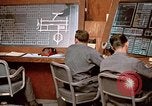Image of Airmen at monitoring stations inside munitions storage facility U-Tapao Royal Thai Air Force Base Thailand, 1969, second 54 stock footage video 65675039061