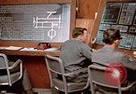 Image of Airmen at monitoring stations inside munitions storage facility U-Tapao Royal Thai Air Force Base Thailand, 1969, second 57 stock footage video 65675039061