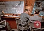 Image of Airmen at monitoring stations inside munitions storage facility U-Tapao Royal Thai Air Force Base Thailand, 1969, second 62 stock footage video 65675039061