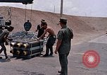Standbild Air Force Munition Team mit mobilen Kran offload Bomben vom Lkw U-Tapao Royal Thai Air Force Base Thailand, 1969, aus Sekunde 22 historischem Filmmaterial Videoclip 65675039067