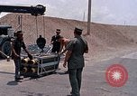 Standbild Air Force Munition Team mit mobilen Kran offload Bomben vom Lkw U-Tapao Royal Thai Air Force Base Thailand, 1969, aus Sekunde 23 historischem Filmmaterial Videoclip 65675039067