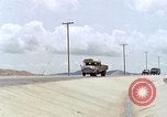Standbild Air Force Munition Team mit mobilen Kran offload Bomben vom Lkw U-Tapao Royal Thai Air Force Base Thailand, 1969, aus Sekunde 48 historischem Filmmaterial Videoclip 65675039067