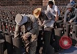 Standbild Thailändische Arbeiter sauber hinteren Abschnitte der M 117 Allgemeine Bomben U-Tapao Royal Thai Air Force Base Thailand, 1969, aus Sekunde 57 historischem Filmmaterial Videoclip 65675039070