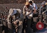Standbild Thailändische Arbeiter sauber hinteren Abschnitte der M 117 Allgemeine Bomben U-Tapao Royal Thai Air Force Base Thailand, 1969, aus Sekunde 58 historischem Filmmaterial Videoclip 65675039070