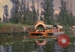 Image of Trajinera boats Mexico City Mexico, 1975, second 1 stock footage video 65675039469