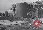 Image of Constructing a petroleum processing facility United States USA, 1943, second 4 stock footage video 65675039521