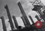 Image of Constructing a petroleum processing facility United States USA, 1943, second 10 stock footage video 65675039521