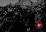 Image of British Mark IV tank with infantry in World War I Western Front, 1917, second 5 stock footage video 65675039556