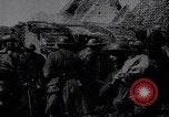 Image of British Mark IV tank with infantry in World War I Western Front, 1917, second 7 stock footage video 65675039556