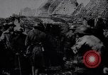 Image of British Mark IV tank with infantry in World War I Western Front, 1917, second 8 stock footage video 65675039556