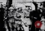 Image of British Mark IV tank with infantry in World War I Western Front, 1917, second 49 stock footage video 65675039556