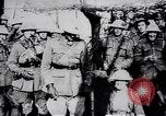 Image of British Mark IV tank with infantry in World War I Western Front, 1917, second 52 stock footage video 65675039556
