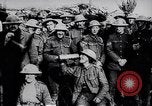 Image of British Mark IV tank with infantry in World War I Western Front, 1917, second 60 stock footage video 65675039556