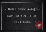 Image of British soldier reads news to civilians Europe, 1918, second 1 stock footage video 65675039557