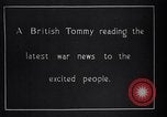 Image of British soldier reads news to civilians Europe, 1918, second 5 stock footage video 65675039557
