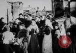 Image of British soldier reads news to civilians Europe, 1918, second 8 stock footage video 65675039557