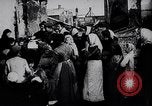Image of British soldier reads news to civilians Europe, 1918, second 18 stock footage video 65675039557